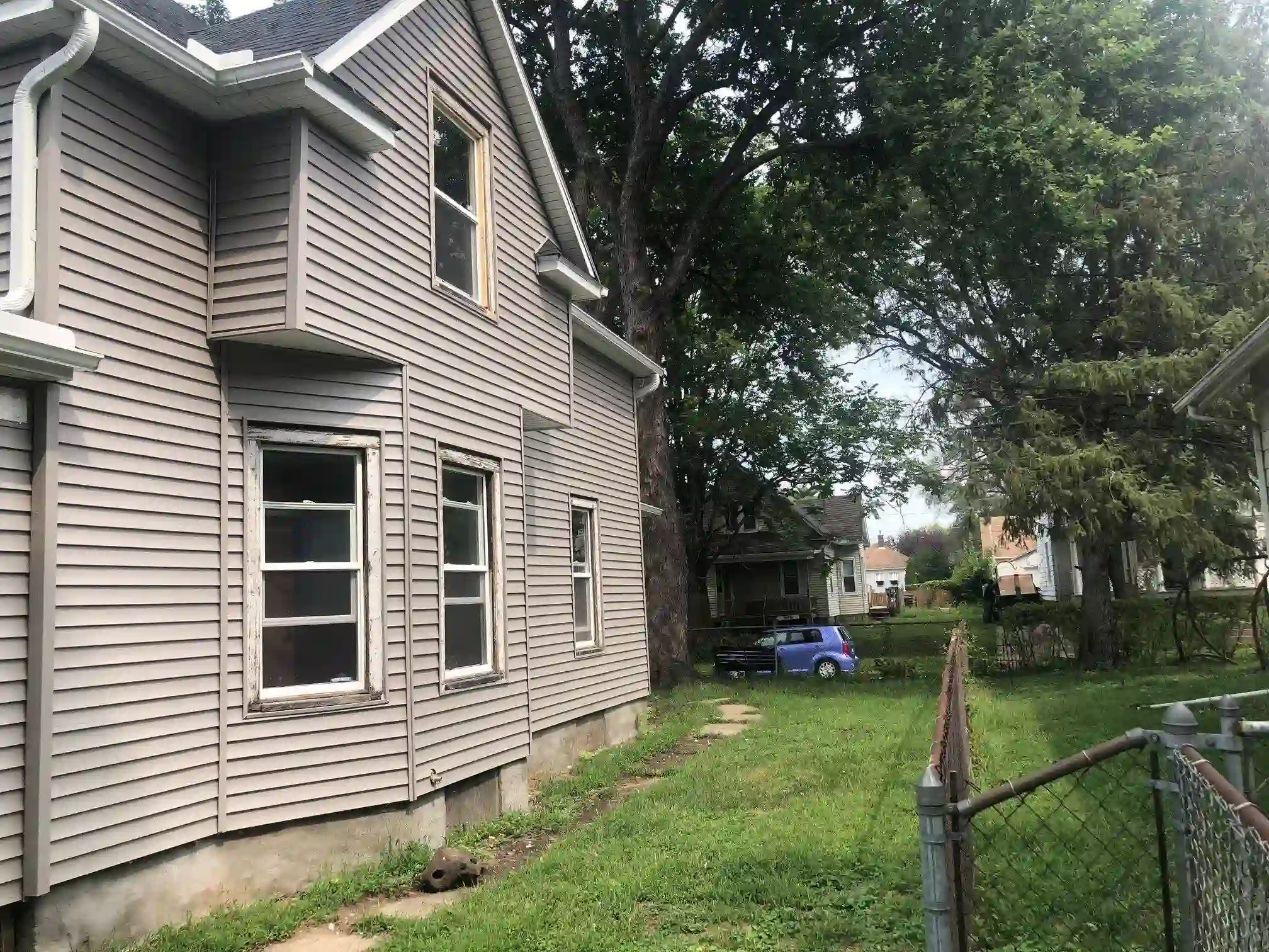 Tan siding home exterior remodel